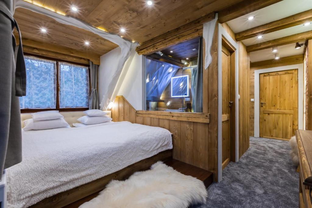Posteľ alebo postele v izbe v ubytovaní Apartamenty Szymaszkowa