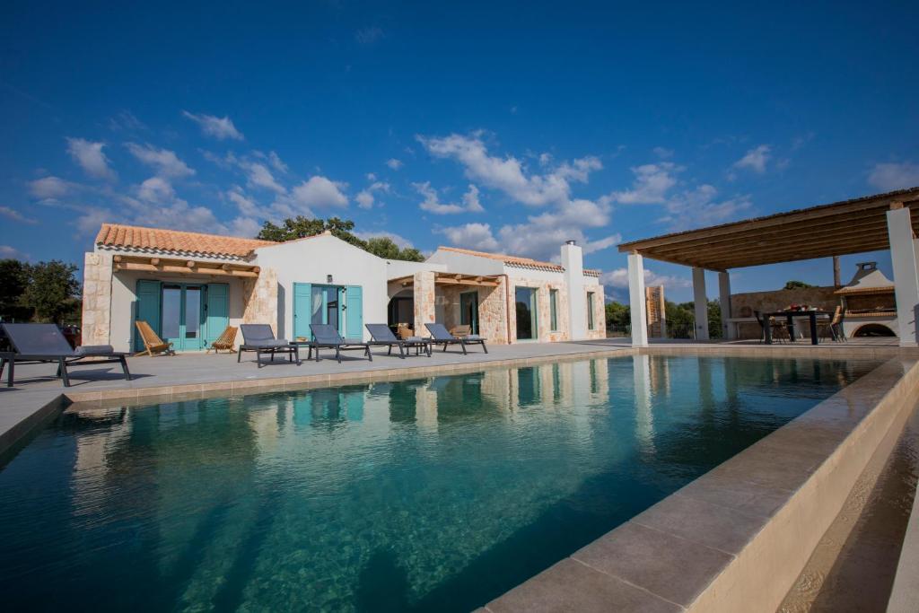 The swimming pool at or close to Exclusive Sea View Villa Madelaine