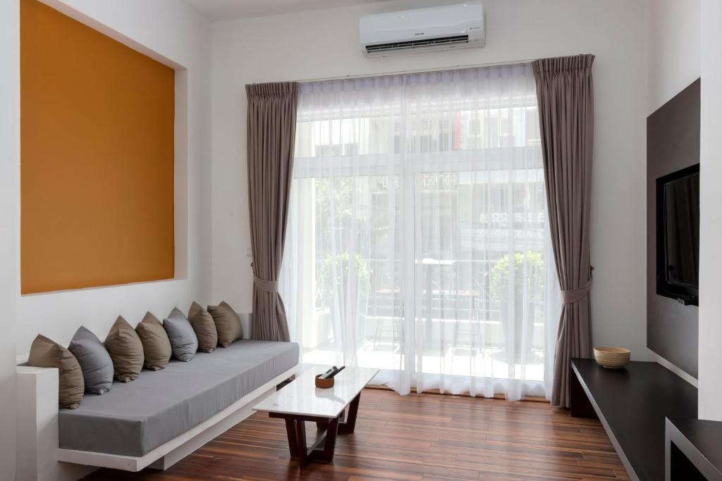 TV a/nebo společenská místnost v ubytování TAO Riverside Residence