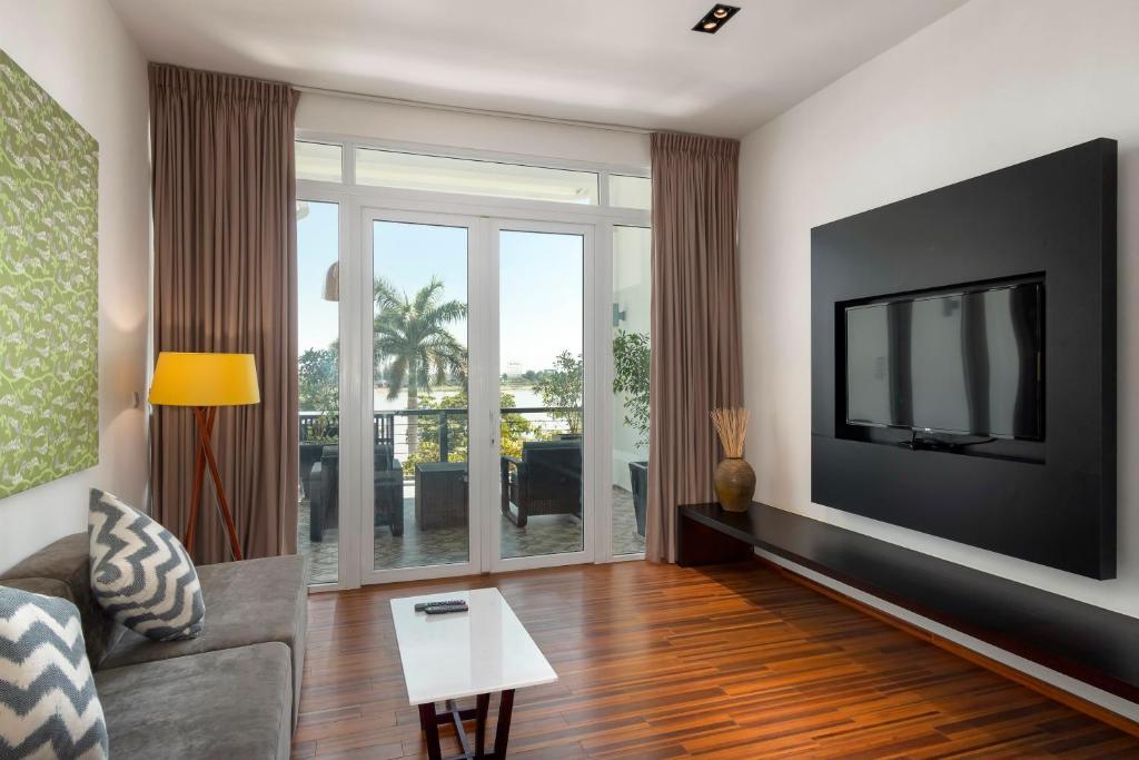 TV a/nebo společenská místnost v ubytování TAO Riverside Residence
