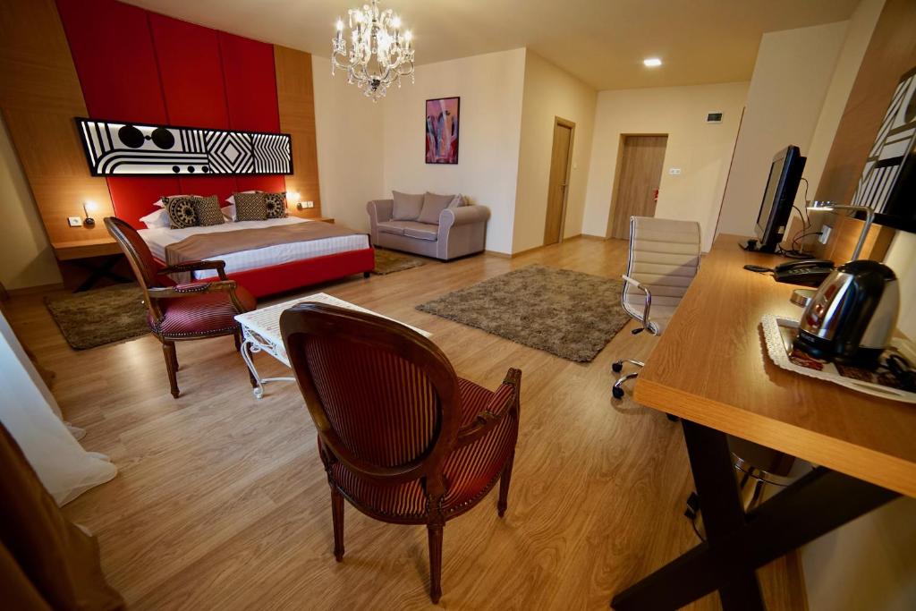 Postel nebo postele na pokoji v ubytování Astoria Hotel & SPA