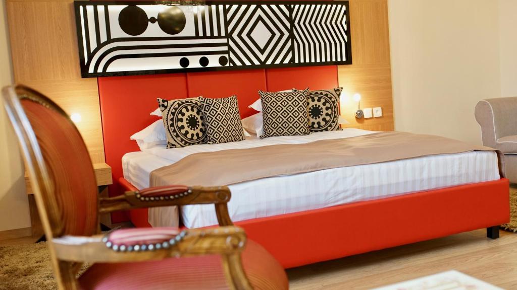 Postel nebo postele na pokoji v ubytování Astoria Hotel & SPA