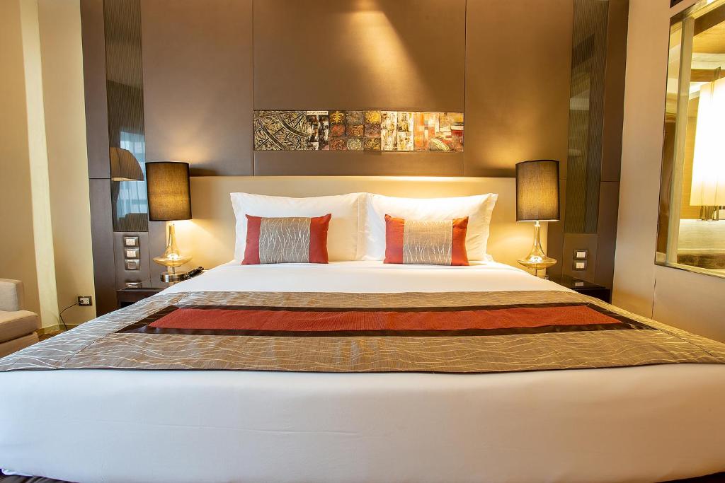 Postel nebo postele na pokoji v ubytování Graceland Bangkok by Grace Hotel - SHA Extra Plus