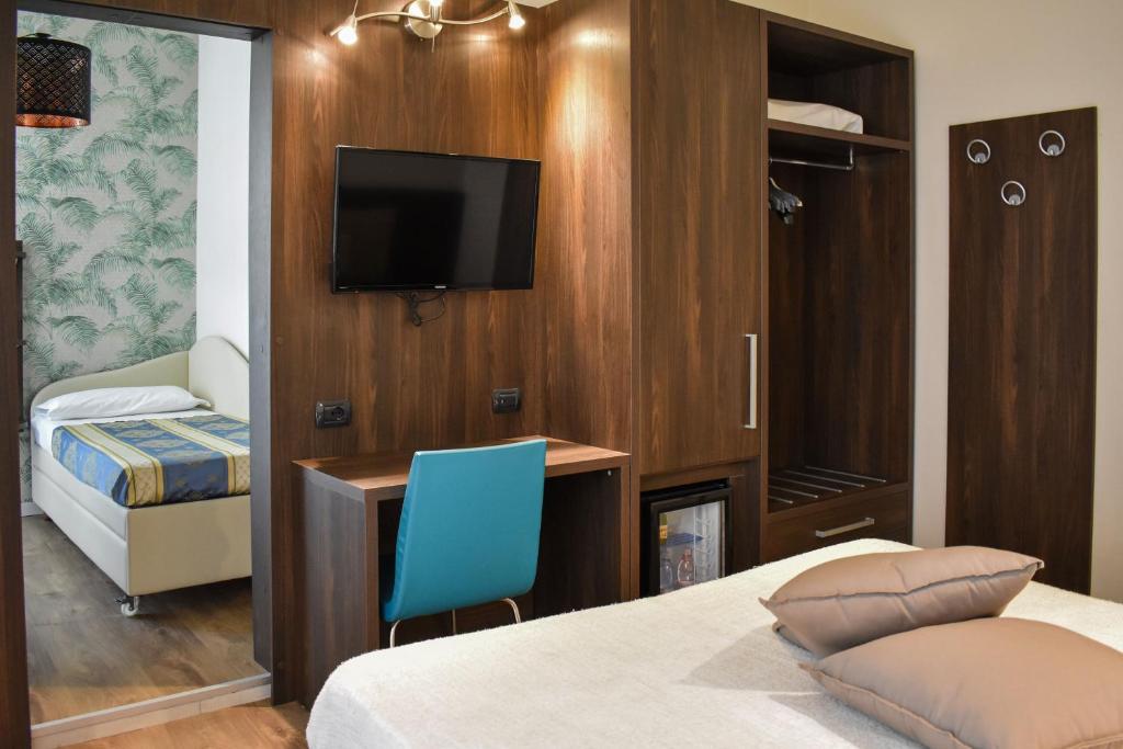 Postel nebo postele na pokoji v ubytování Hotel Dear Rimini