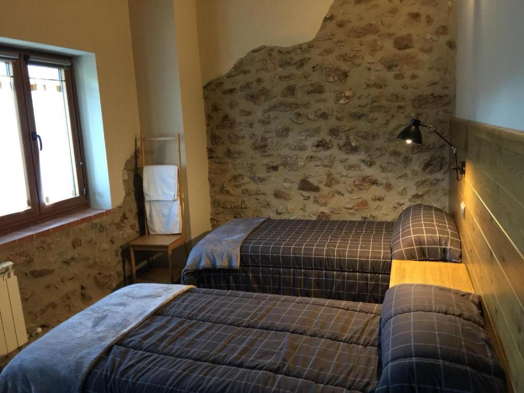 Postel nebo postele na pokoji v ubytování Cal Pedrals Pairal
