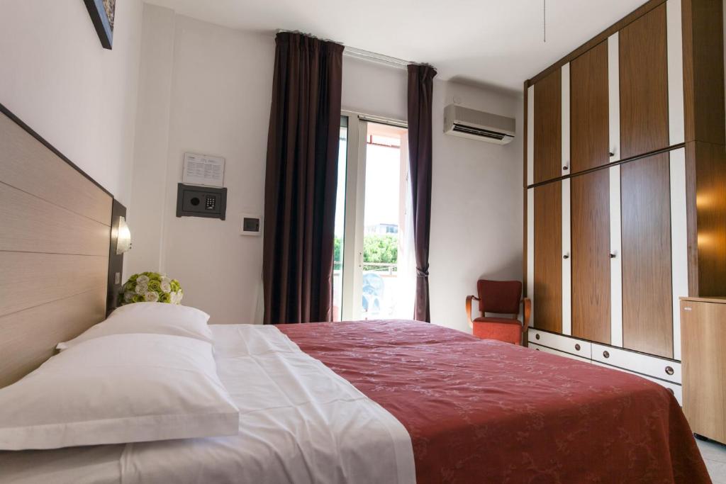 Postel nebo postele na pokoji v ubytování Hotel Zenith