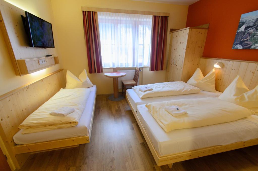 Postel nebo postele na pokoji v ubytování JUFA Hotel Donnersbachwald