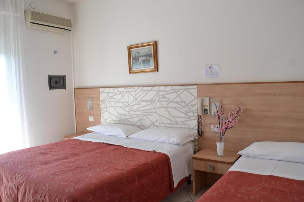 Postel nebo postele na pokoji v ubytování Hotel Zenith