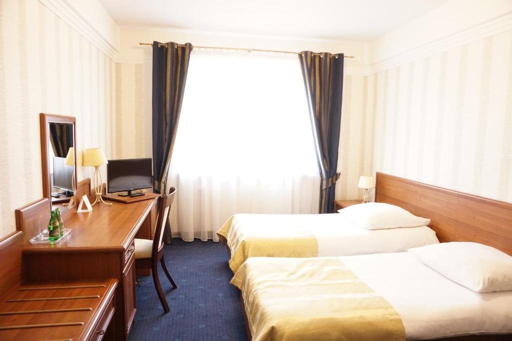 Postel nebo postele na pokoji v ubytování Hotel Mistral