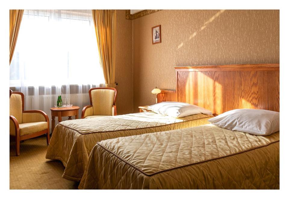 Postel nebo postele na pokoji v ubytování Hotel Mistral