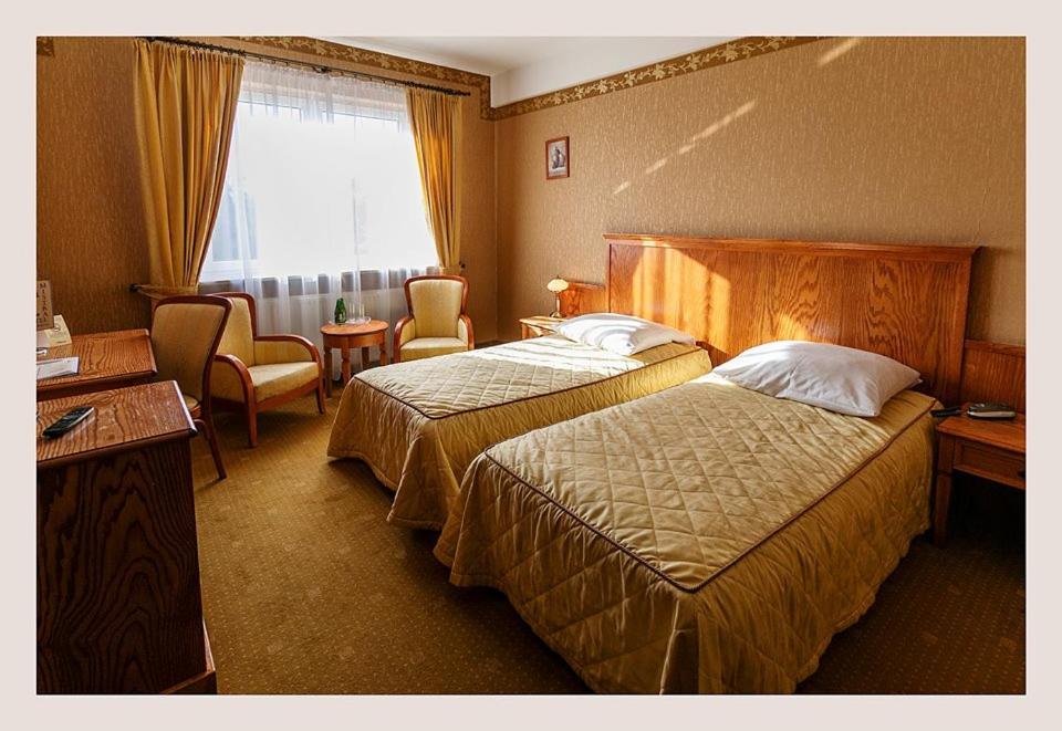 Postel nebo postele na pokoji v ubytování Hotel Mistral