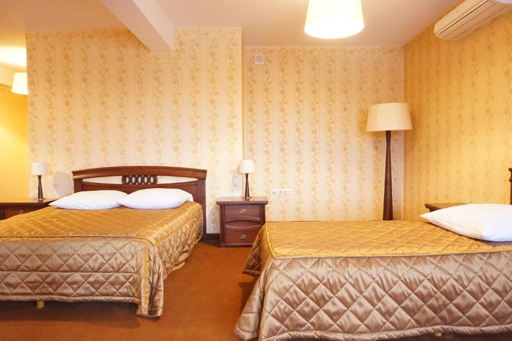 Postel nebo postele na pokoji v ubytování Hotel Mistral