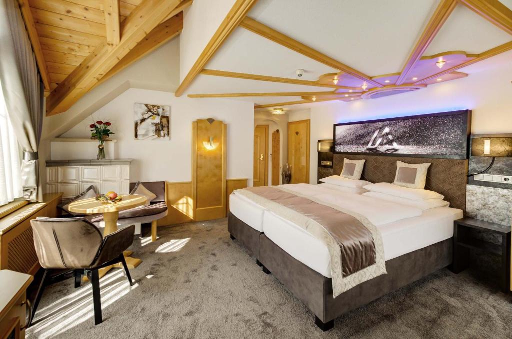 Alpinstyle Hotel Ischglにあるベッド