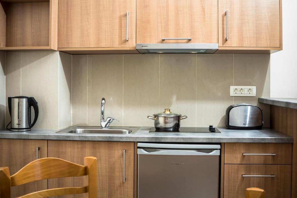 a small kitchen with a sink and a stove at Gramvoussa Bay in Kissamos