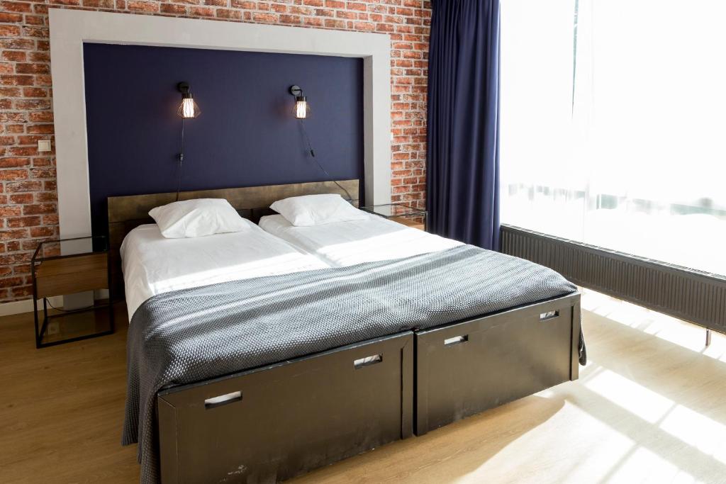 Postel nebo postele na pokoji v ubytování Hotel Spelderholt