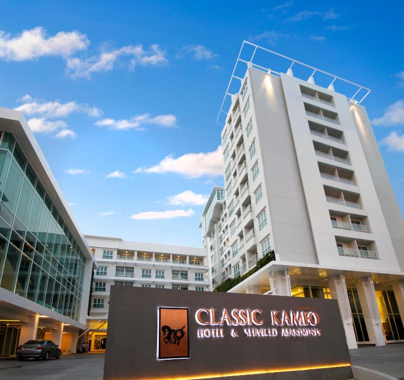a large white building with a sign in front of it at Classic Kameo Hotel & Serviced Apartments, Ayutthaya in Phra Nakhon Si Ayutthaya