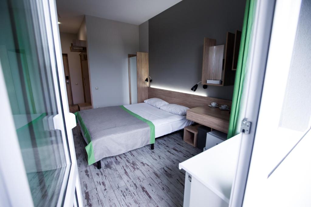 Postel nebo postele na pokoji v ubytování Hotel Vesna