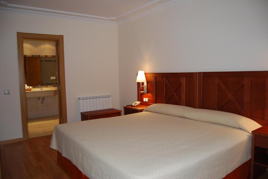 Postel nebo postele na pokoji v ubytování Hotel Meleiros