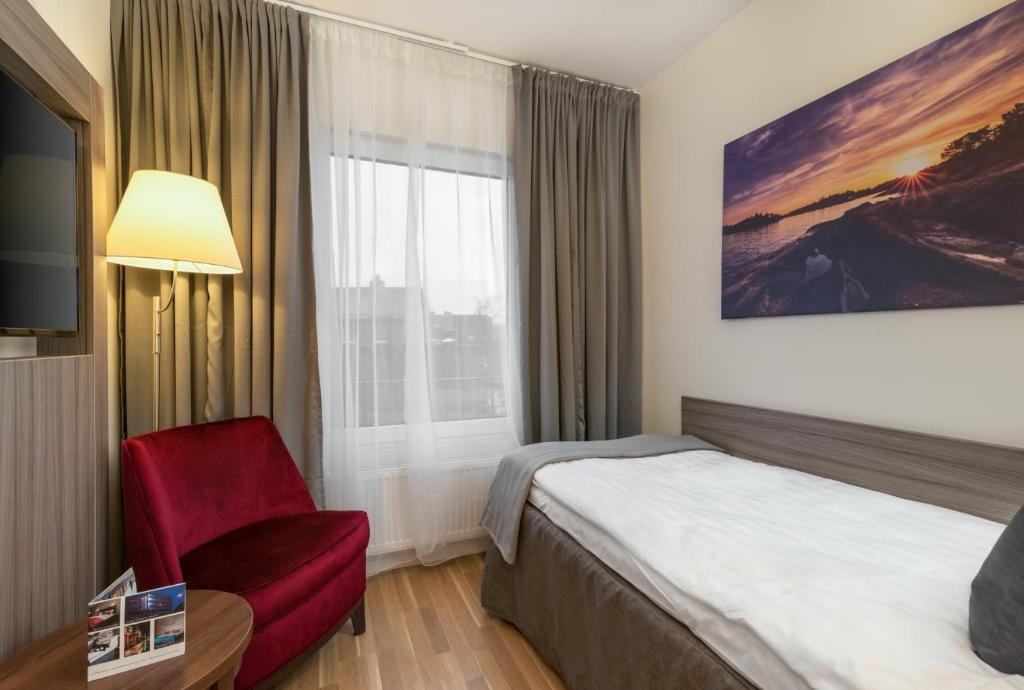 Postel nebo postele na pokoji v ubytování Hotel Oxelösund