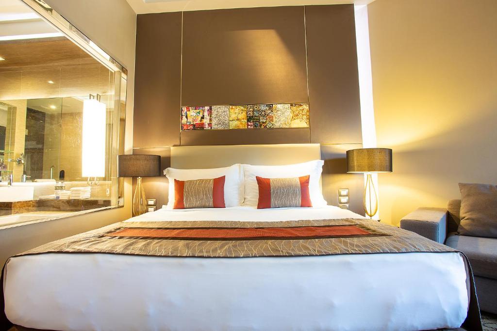 Postel nebo postele na pokoji v ubytování Graceland Bangkok by Grace Hotel - SHA Extra Plus