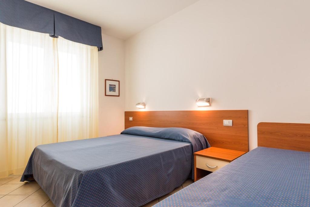 Posteľ alebo postele v izbe v ubytovaní Residence Sant'Anna