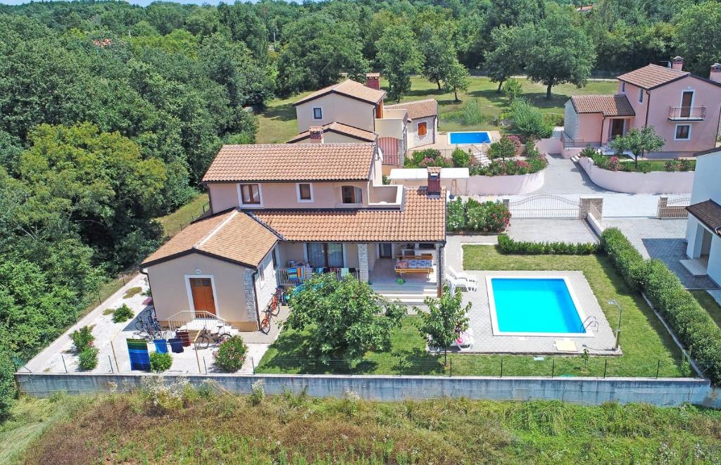 an aerial view of a house with a swimming pool at Villa Paris III in Radetići