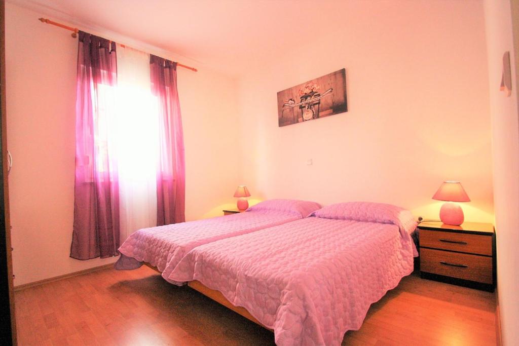 Postel nebo postele na pokoji v ubytování Apartment Mendikovic