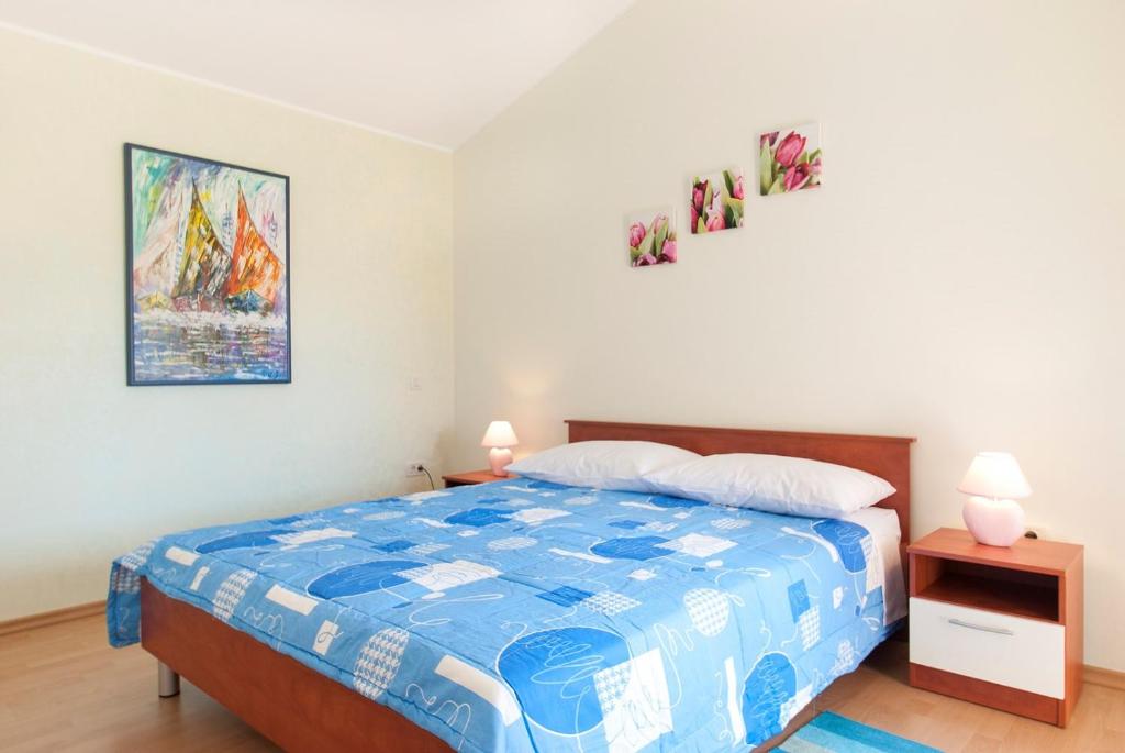 Postel nebo postele na pokoji v ubytování Villa Paris III