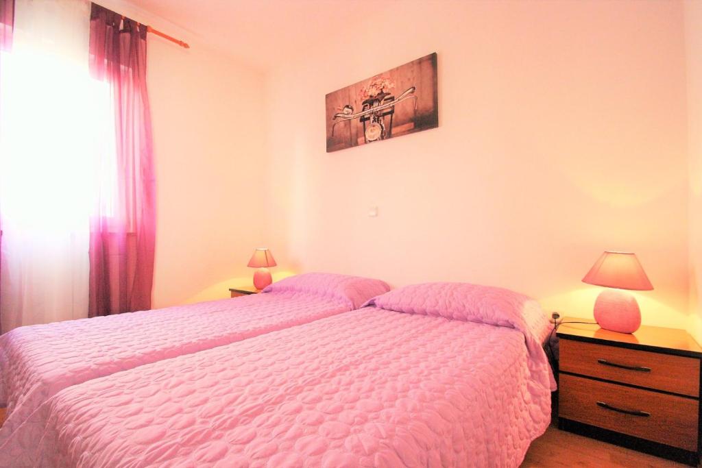 Postel nebo postele na pokoji v ubytování Apartment Mendikovic