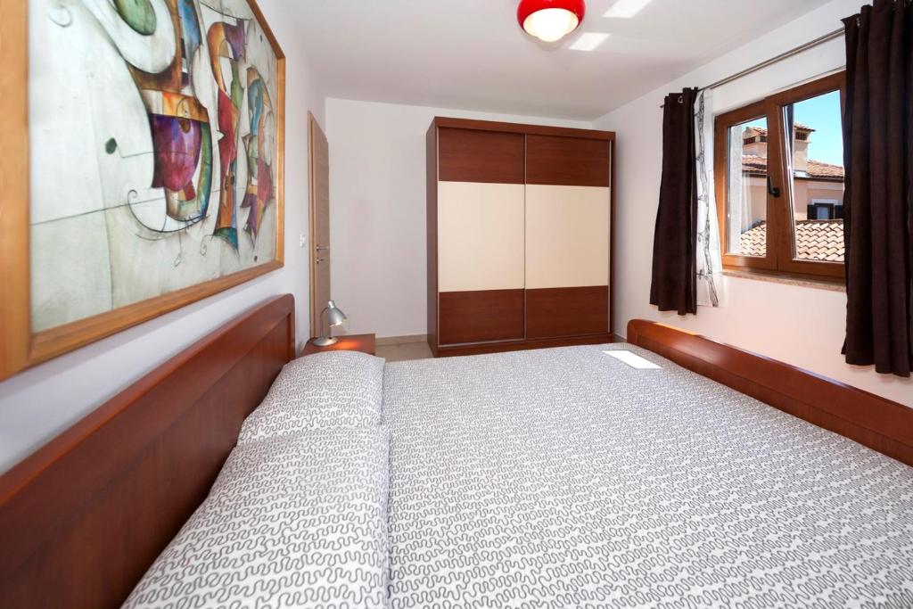 Postel nebo postele na pokoji v ubytování Apartments Beakovic