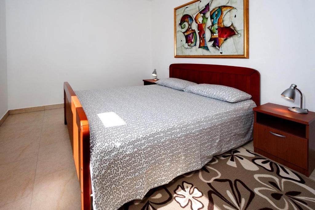 Postel nebo postele na pokoji v ubytování Apartments Beakovic