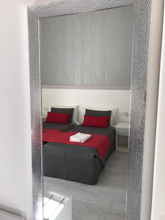 Łóżko lub łóżka w pokoju w obiekcie Chiaia Guest House