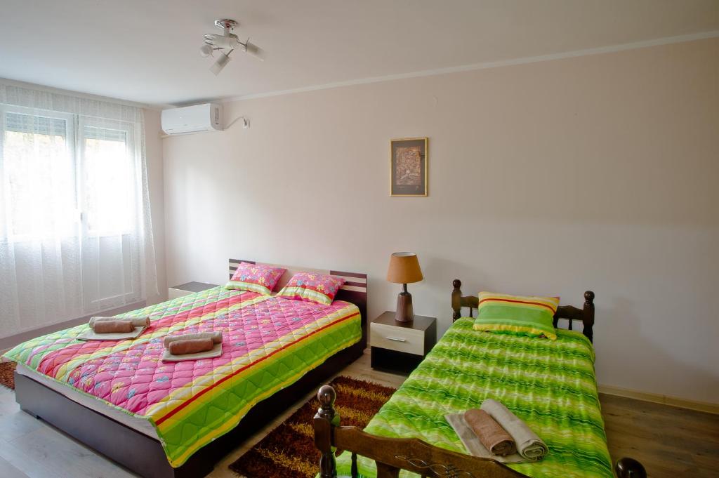 Postel nebo postele na pokoji v ubytování Park Apartman