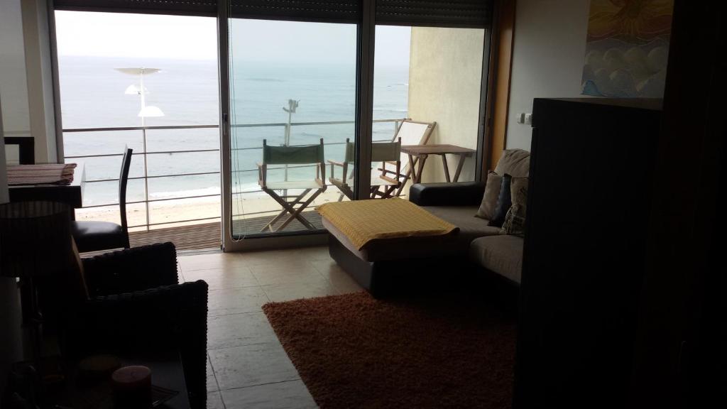 a living room with a view of the ocean at Perfect Sea View in Vila do Conde
