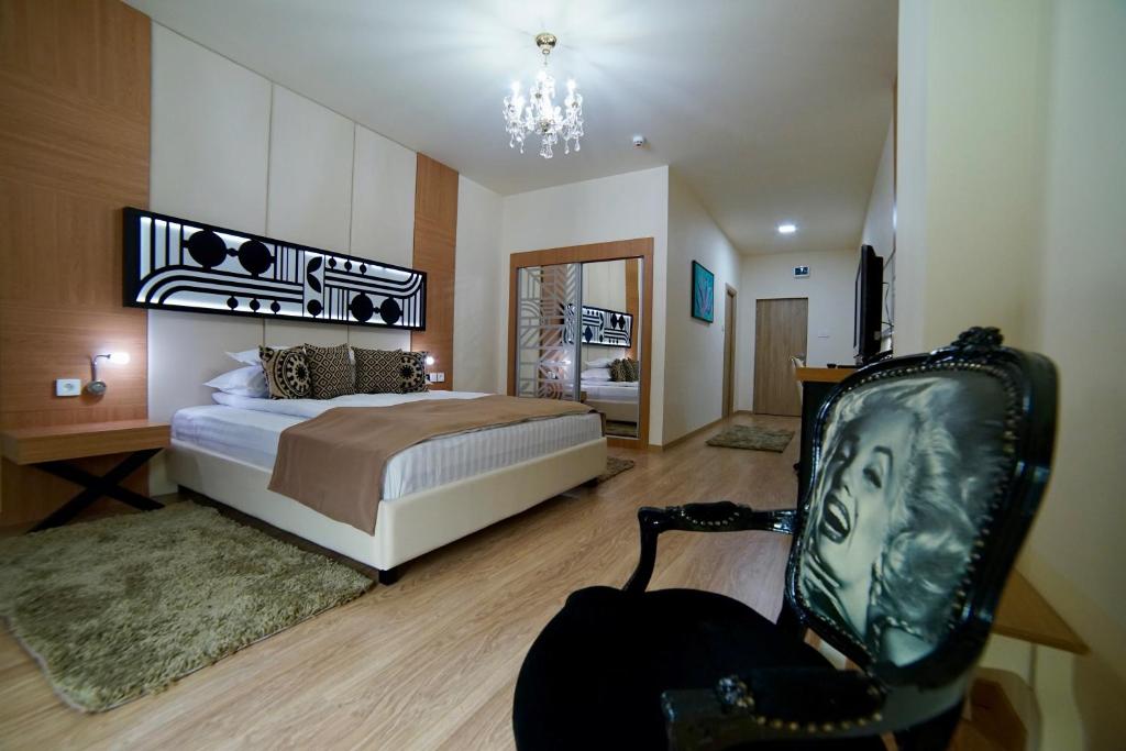 Postel nebo postele na pokoji v ubytování Astoria Hotel & SPA