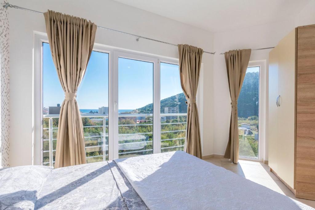 Postel nebo postele na pokoji v ubytování Apartments DILARA
