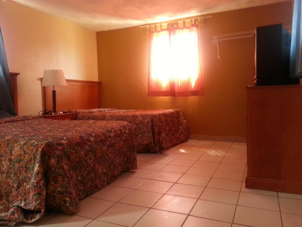 Postel nebo postele na pokoji v ubytování Atlantic Inn