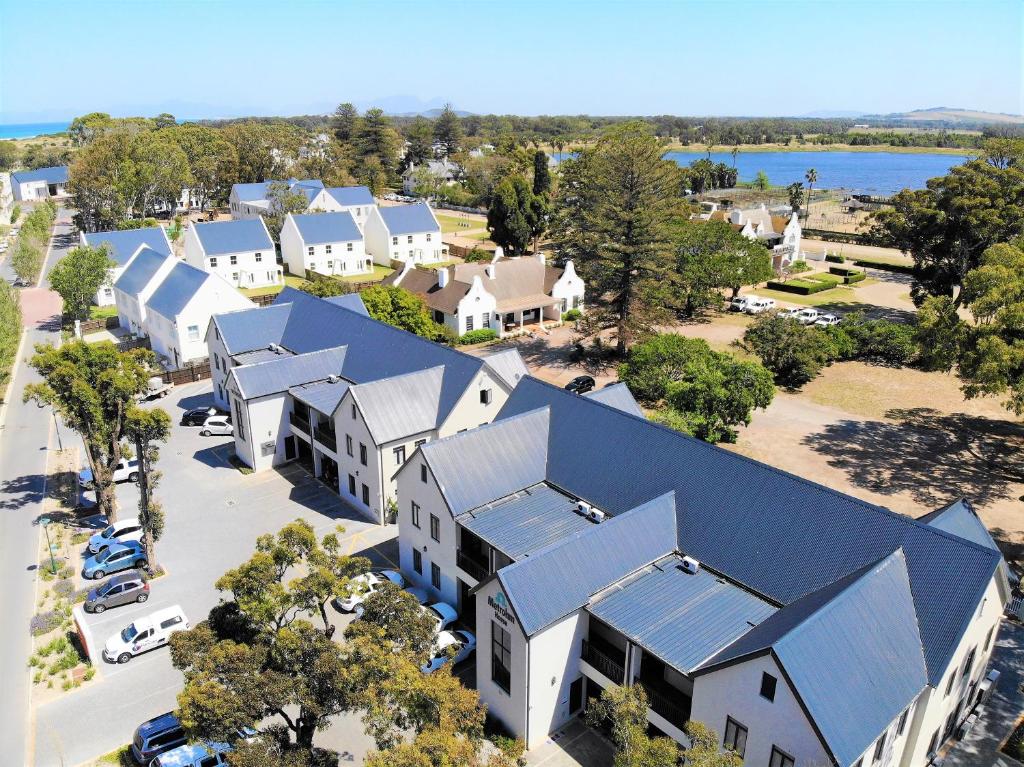an aerial view of a house with blue roofs at Crossfire @ Home in Somerset West