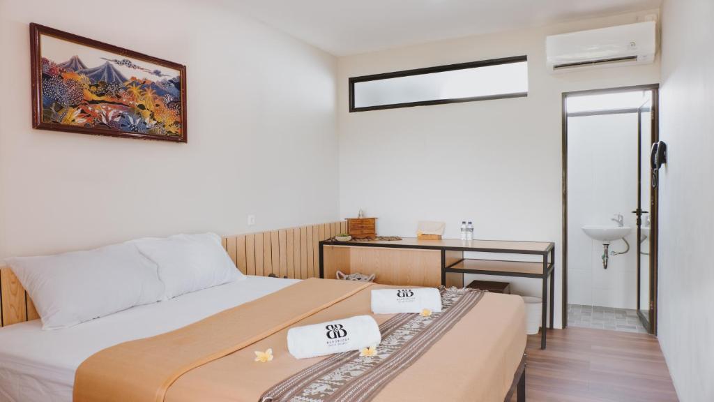 Postel nebo postele na pokoji v ubytování Borobudur Bed & Breakfast