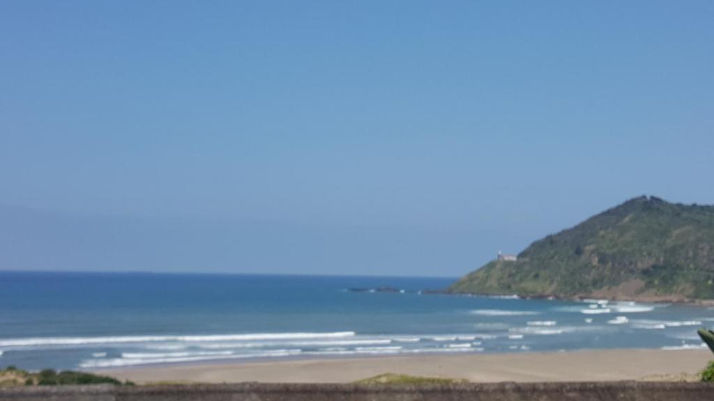 a view of the ocean from a beach at Tranquility PsJ in Port St Johns