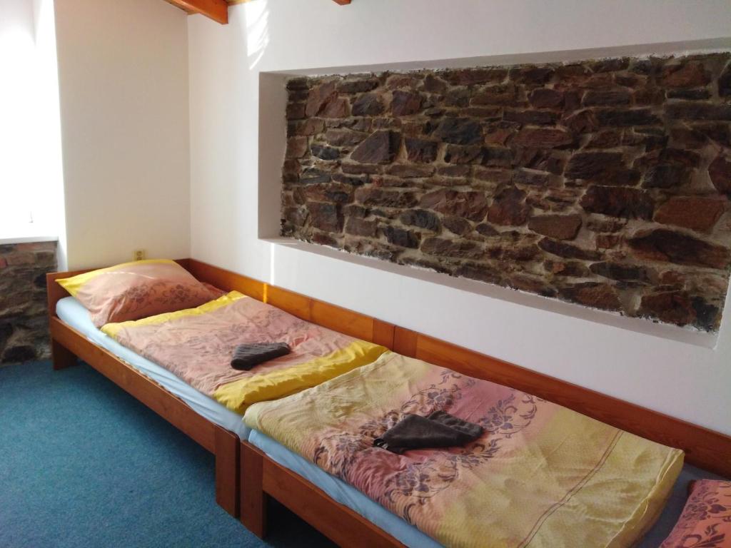 Postel nebo postele na pokoji v ubytování Hostinec Peterka