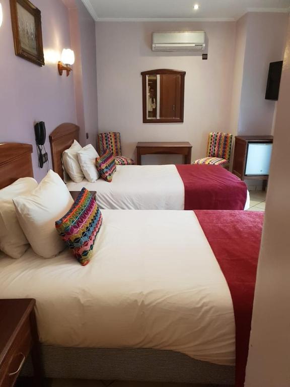 Postel nebo postele na pokoji v ubytování Hôtel Amouday