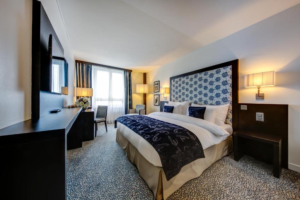 Voodi või voodid majutusasutuse Hotel Beaulac toas