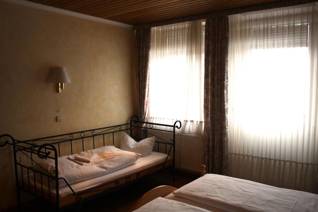 Postel nebo postele na pokoji v ubytování Privathotel Brügges Loui