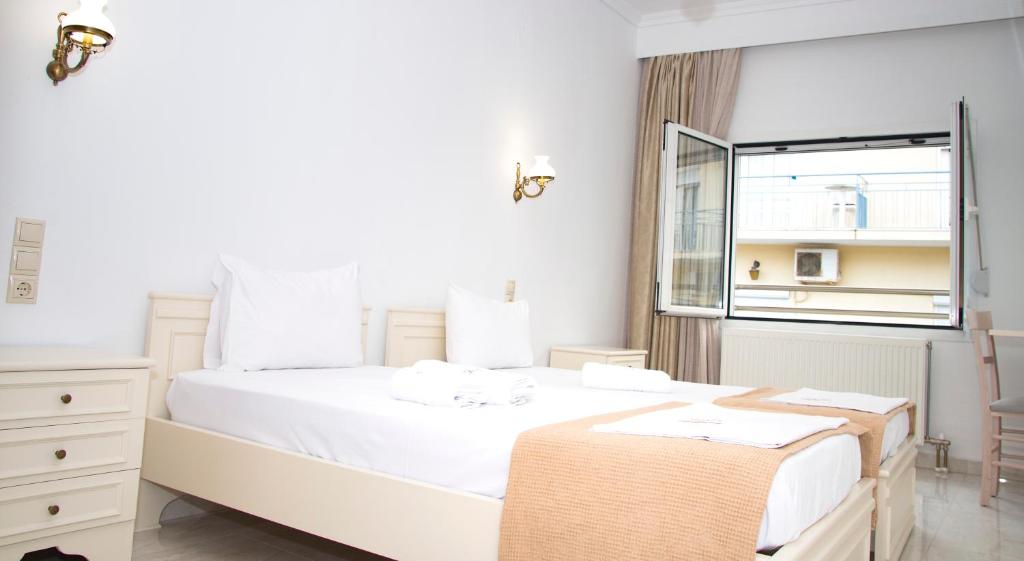 Cama ou camas em um quarto em Hotel Astron