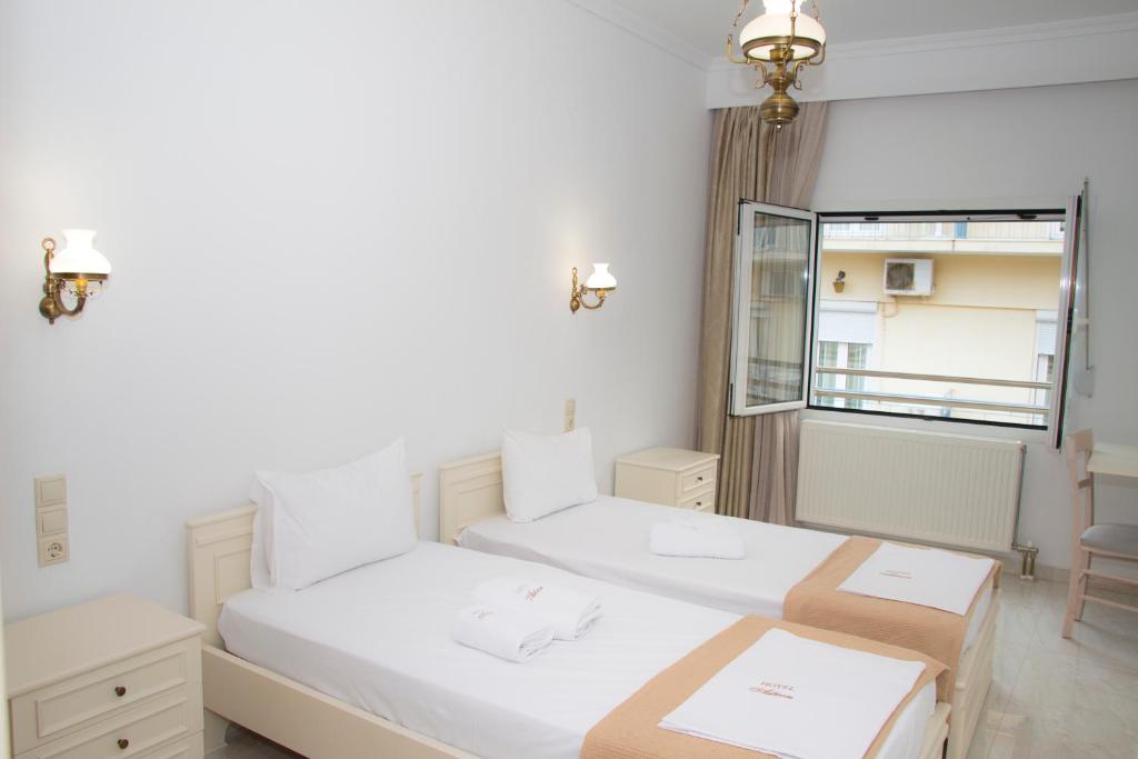 Cama ou camas em um quarto em Hotel Astron
