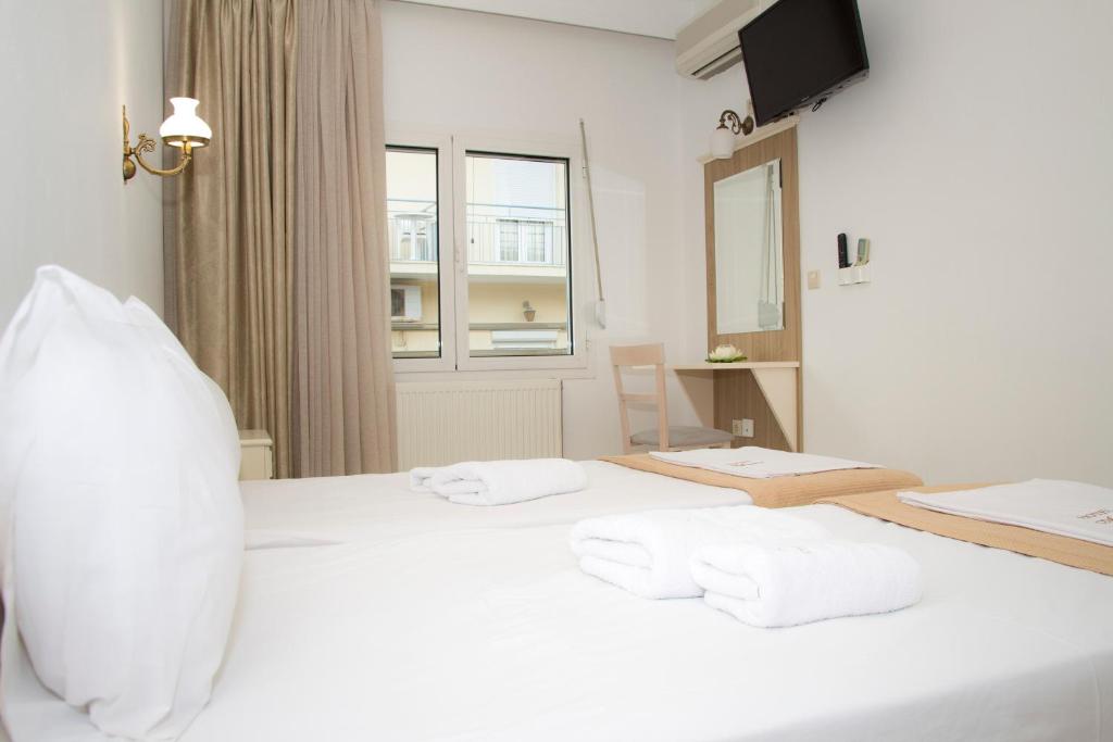 Cama ou camas em um quarto em Hotel Astron