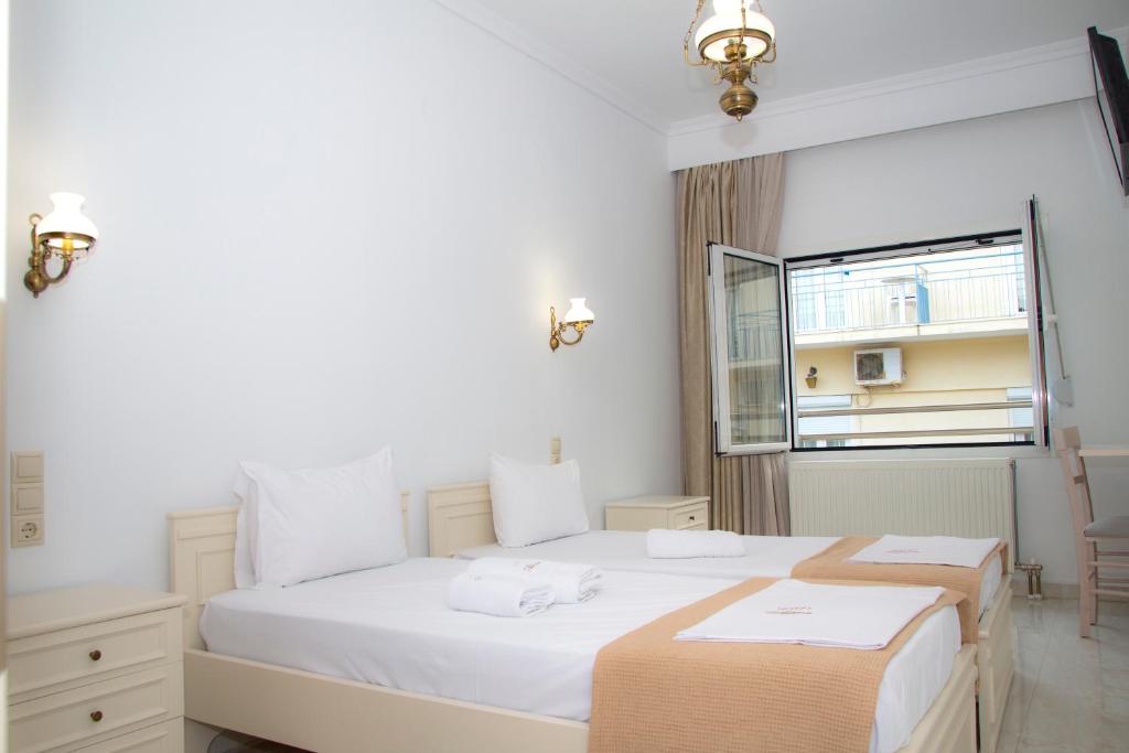 Cama ou camas em um quarto em Hotel Astron