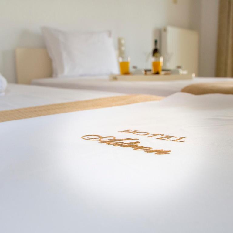 Cama ou camas em um quarto em Hotel Astron