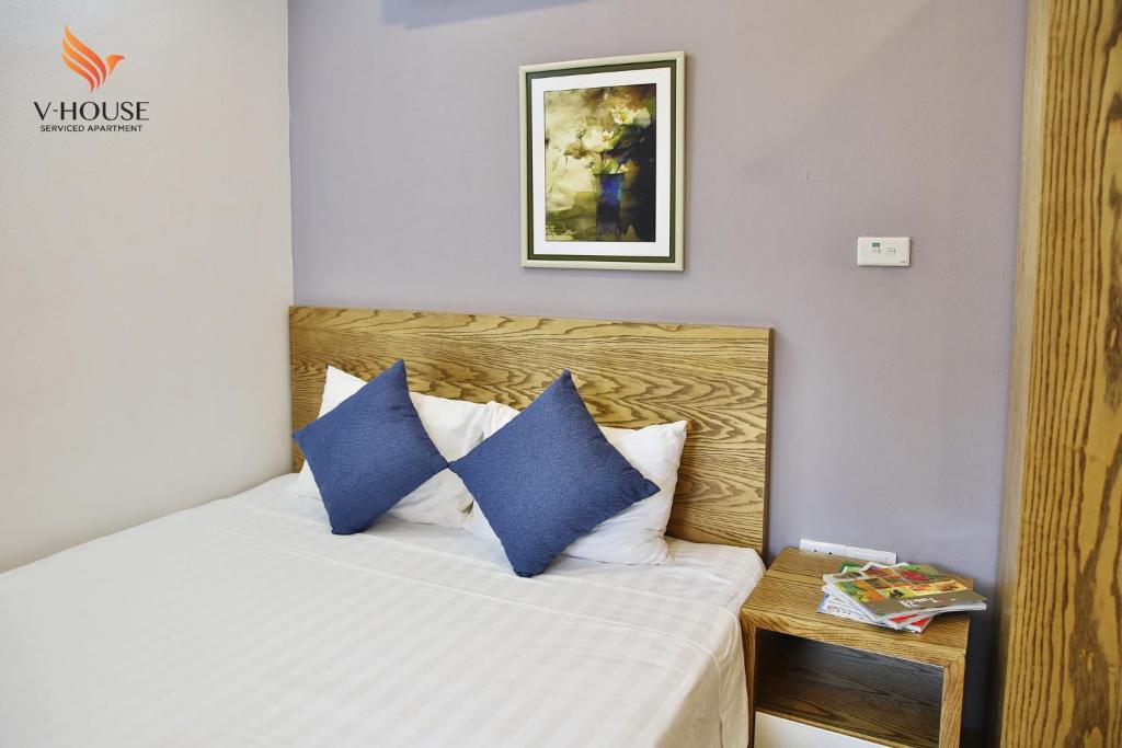 Postel nebo postele na pokoji v ubytování V House 5 Serviced Apartment